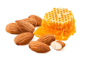 Almonds and honeycomb, nuts with honey isolated on white background.