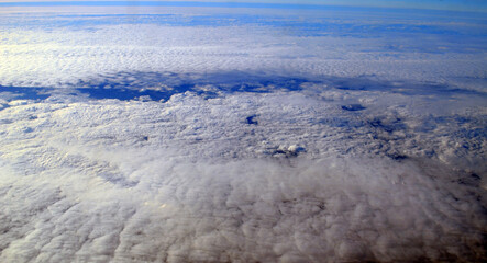 Aerial view of clouds and sky. Bird eye view from airplane window. Clouds panorama from airplane. Flight from Kiev to Sharm El Sheikh, Egypt.