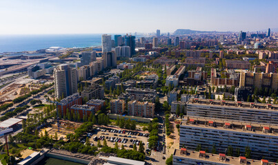 Fototapeta premium Aerial view of modern buildings in coastal areas of Diagonal mar in Barcelona, Spain
