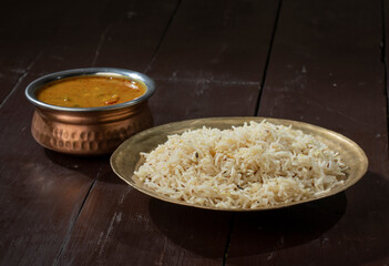 Indian Cuisine Jeera Rice With Dal Tadka Also Know As Cumin Rice on Vintage Wooden Background