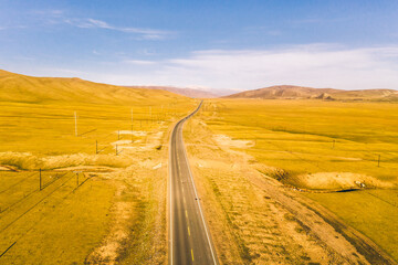 Fototapeta na wymiar Aerial photography of desert road in Xinjiang, China