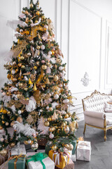 decorated christmas tree in a bright interior. New year concept 
