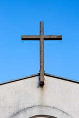 Old rusty metal cross in church