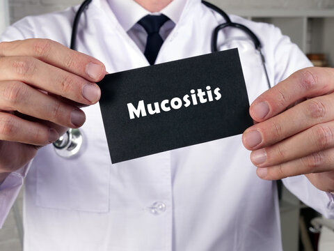 Medical concept about Mucositis with inscription on the piece of paper.
