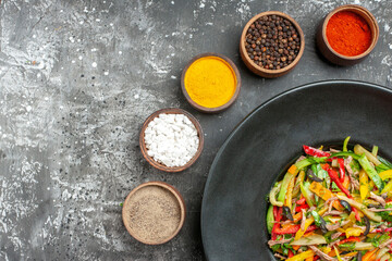 top view tasty vegetable salad with seasonings on light-grey desk meal color photo health food