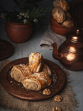 Georgian traditional dessert kada or gata. Shortbread cookies with nuts, vanilla and sugar sprinkled sesame seeds on the table served for tea close up