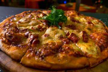 top view Traditional crispy Italian pizza with cheese and chistorras black rustic wooden background. Top view of hot pizza. restaurant blur background