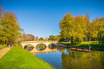 Fototapeta na wymiar Beautiful sunny autumn scenery of river Cam with mooring boat. Cambridge city. England