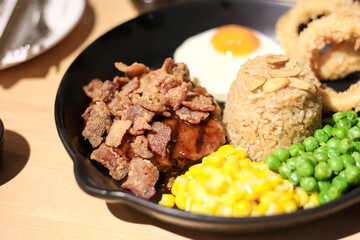 Griled chicken breast steak with  rice and onions,corns,Green peas vegetable,soft focus