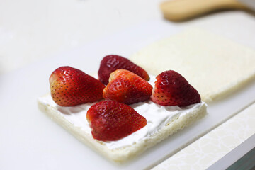 Making sandwich Strawberry fresh cream with fresh whipping cream.
