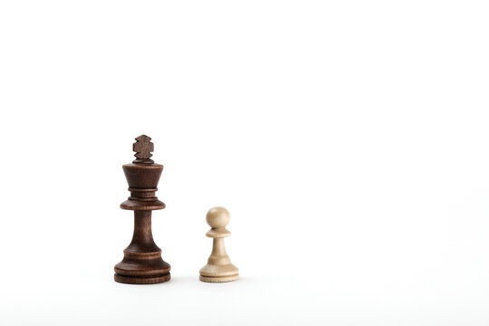 king and pawn on white background