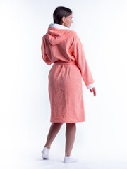 woman in a dressing gown from the back on an isolated white background.