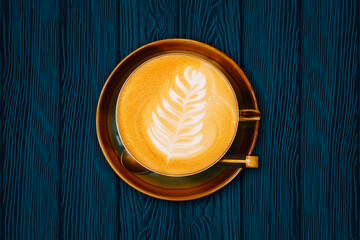Top view of hot coffee cup on wood table background.