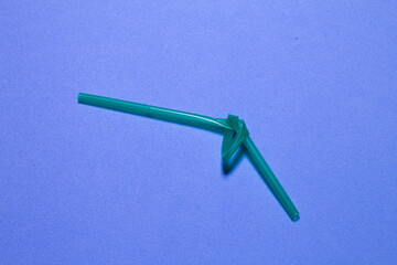 Close up view of a plastic straw with a knot as a concept for prohibition in the EU