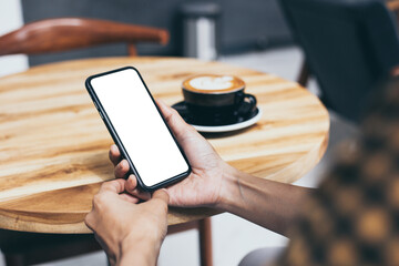 cell phone blank white screen mockup.woman hand holding texting using mobile on desk at office.background empty space for advertise.work people contact marketing business,technology