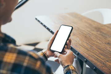 cell phone blank white screen mockup.woman hand holding texting using mobile on desk at office.background empty space for advertise.work people contact marketing business,technology