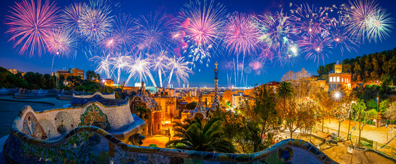Beautiful fireworks show in Barcelona seen from Park Guell. Park was built from 1900 to 1914 and...