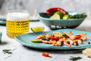 Traditional Low Country boil. Grilled shrimps or prawns served with lime. Seafood. Summertime feast