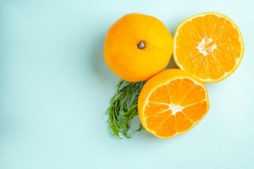top view fresh tangerine slices on light-blue background photo fruits citrus orange color