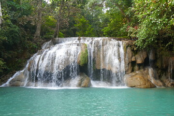 Fototapeta na wymiar Photo picture of a fascinating view Thailand waterfall and the azure water with colors on the sun