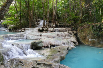 Photo picture of a fascinating view Thailand waterfall and the azure water with colors on the sun