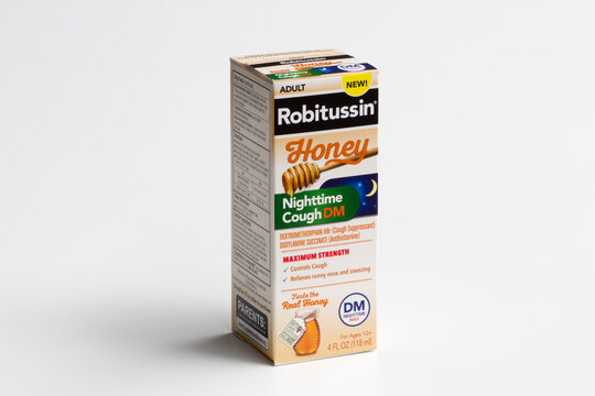 Portland, OR, USA - July 1, 2020: A pack of Robitussin Honey Maximum Nighttime Cough DM isolated on a white background. Robitussin DM contains two active ingredients, dextromethorphan and guaifenesin.