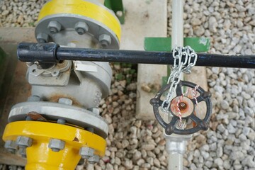 Key lock and chain to prevent the valve being opened is part of the Lock out tag out system in oil and gas plant.