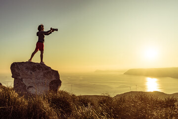 Woman with camera take travel photo