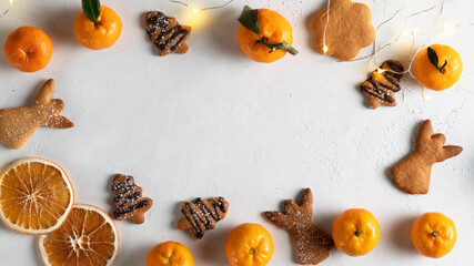 Tangerine and orange background with Christmas gingerbread homemade cookies.