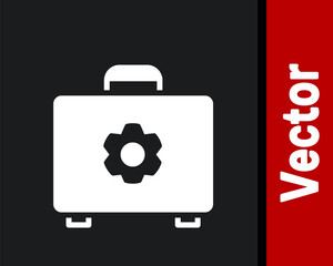 White Toolbox icon isolated on black background. Tool box sign. Vector Illustration.