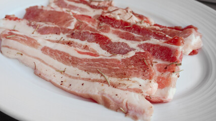 Fresh raw pork belly on plate for Samgyeopsal or Korean BBQ.