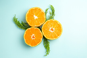 top view fresh tangerine slices on a light-blue background photo fruit color citrus orange