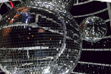Silvery Mirror ball for Illumination on decoration construction. Close-up with limited depth of field.
