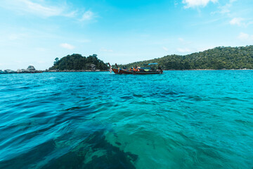 Fototapeta premium Long-tailed boat prow in the blue sea and clear sky.