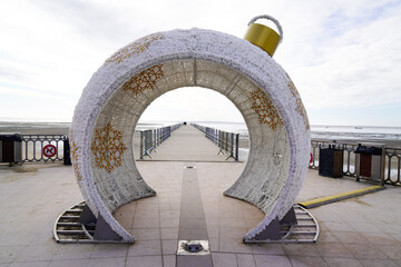 Giant Christmas ball in the street seacoast in Andernos city in Arcachon bay aside pontoon