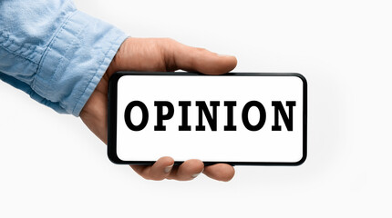 Closeup of a male hand holding Smartphone with word Opinion on display