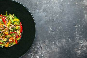 top view delicious vegetable salad inside plate on grey background color photo meal health food free place