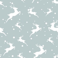 seamless winter pattern with white snowflakes and deers with antlers.