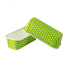 Green paper baking forms for cakes with dotted pattern