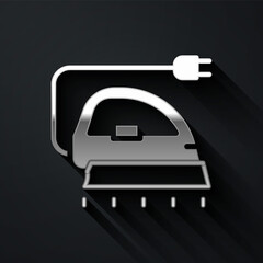Fototapeta premium Silver Electric iron icon isolated on black background. Steam iron. Long shadow style. Vector.