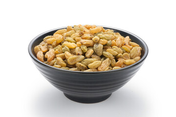 Raisins in a black bowl isolated on white background.