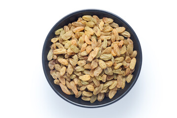 Raisins in a black bowl isolated on white background. Top view.