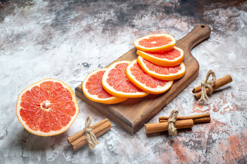 front view fresh grapefruits sliced on light-background color juice citrus fruit fresh photo