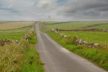 Small narrow country road to Moher Tower at Hag's Head, county Clare, Ireland. Selective focus....