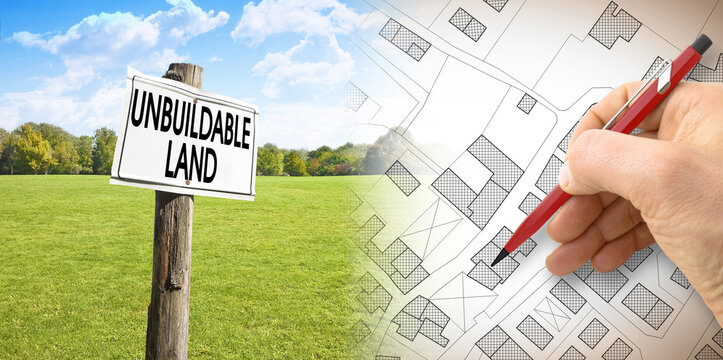 a hand holding a sign that says divorce divorce - Unbuildable land - concept image with an imaginary
