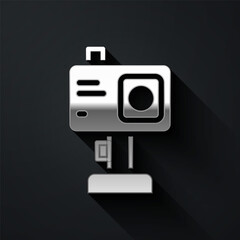 Silver Action extreme camera icon isolated on black background. Video camera equipment for filming extreme sports. Long shadow style. Vector.