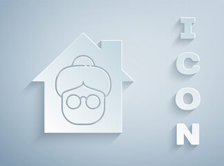 Paper cut Nursing home building icon isolated on grey background. Health care for old and sick people. Center for retired people. Paper art style. Vector.
