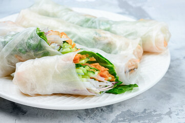 Spring rolls close up. A healthy dish with vegetables and shrimps.