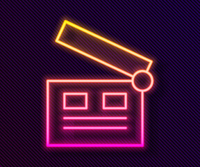 Glowing neon line Movie clapper icon isolated on black background. Film clapper board. Clapperboard sign. Cinema production or media industry. Vector Illustration.