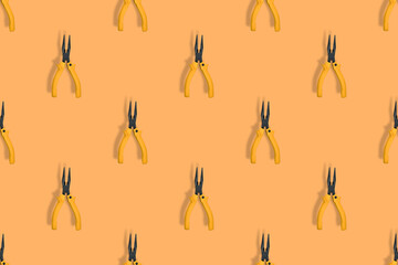 Seamless pattern.Seamless pattern of tools. Pliers background.
